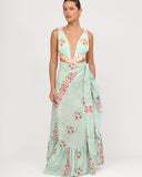 Model wearing the RIVA BLUE 02 pareo in aqua floral print with side tie on the beach