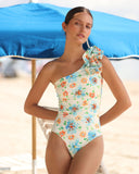 Model wearing the GIARDINO one-piece swimsuit at the beach
