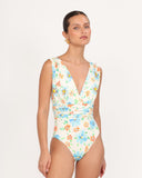 Front view of the GIARDINO 04 one-piece swimsuit with deep V-neckline and floral print