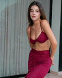 AMARA wine red resort skirt featuring ruched draping and adjustable slit