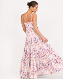 Back view of floral maxi dress with adjustable straps and flowing silhouette