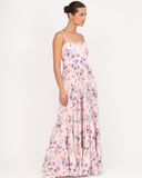 Side view of floral tiered maxi dress showing movement and soft fabric flow