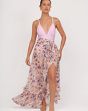 Floral wrap skirt cover up with ruffles and high slit paired with blush swimsuit front view