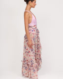 Side view of floral resort wrap skirt with ruffle details and adjustable tie