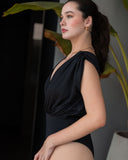 CAPRI black one-piece swimsuit showcasing sculpted silhouette and minimalist design