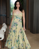 Woman wearing GIBBOR printed mesh maxi dress with tiered skirt and delicate straps from SOLSTICE Resort 2026 collection