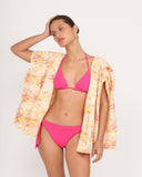 Gioia di Sole floral resort blazer styled with fuchsia bikini, lightweight open-front beach layering piece