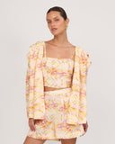 Floral linen crop top with square neckline styled with matching shorts and blazer, front view resort outfit