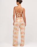 Back view of Gioia di Sole sheer floral mesh pants with ruched waistband.