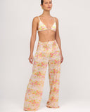 Front view of Gioia di Sole mesh resort pants in sheer floral fabric with ruched waistband and wide-leg silhouette.