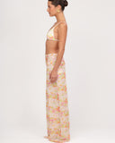 Side view of Gioia di Sole mesh pants highlighting wide-leg silhouette and lightweight fabric.