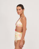 Side view of the Gioia di Sole one piece swimsuit in ivory floral print with flattering high-waisted fit.