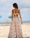 Back view of Gioia di Sole floral wide-leg resort pants with elastic waistband and flowing silhouette.
