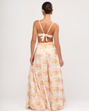 Studio back view of Gioia di Sole wide-leg floral pants with elastic waistband.