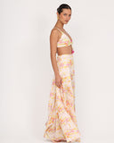 Side view of Gioia di Sole resort pants showing flowy wide-leg silhouette and soft fabric movement.