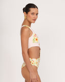 Side view of SABBIA 03 one-piece swimsuit highlighting waist cut-out and silhouette