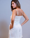 Back view of Scalea white linen shorts with clean tailored silhouette
